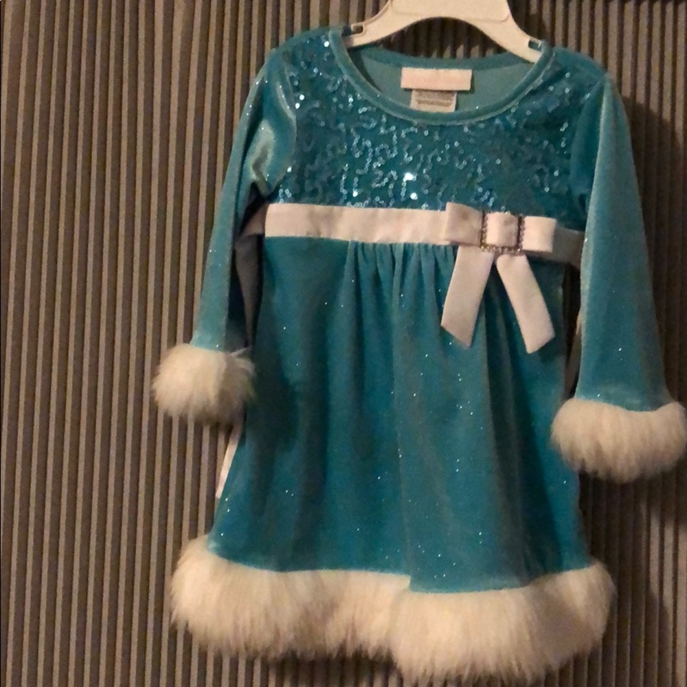 In beautiful blue Santa dress